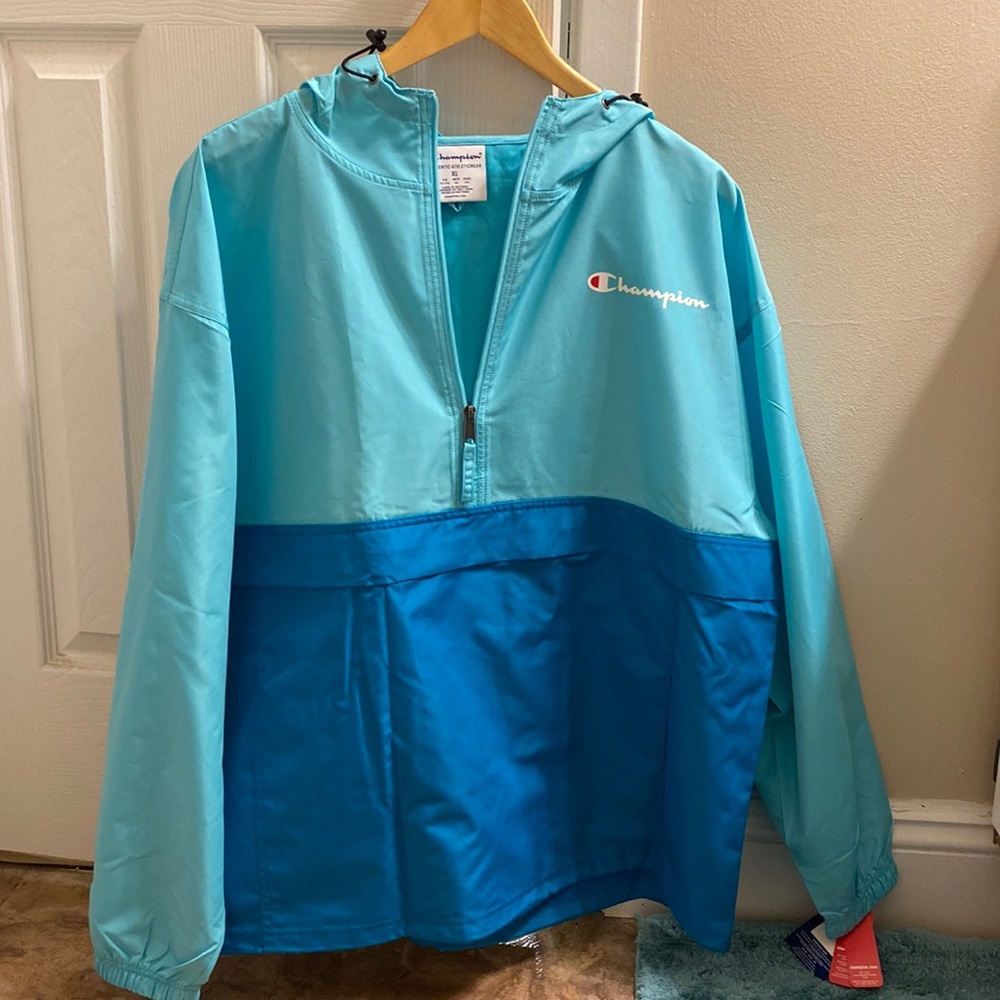 A blue champion rain coat - Picture 1 of 3